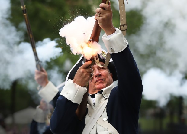 Members of the Aleppo Minutemen fire their muskets during Ancient and Honorables 385th changing of the guard ceremony in Boston Staff Photo by Nancy Lane/Boston Herald (Monday,June 5, 2023). on the Boston Common on Monday, in Boston, MA. (Nancy Lane/Boston Herald) June 5, 2023