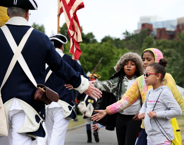 Third and fourth grade students with the Philbrick School greet marchers during Ancient and Honorables 385th changing of the guard ceremony in Boston Staff Photo by Nancy Lane/Boston Herald (Monday,June 5, 2023). on the Boston Common on Monday, in Boston, MA. (Nancy Lane/Boston Herald) June 5, 2023