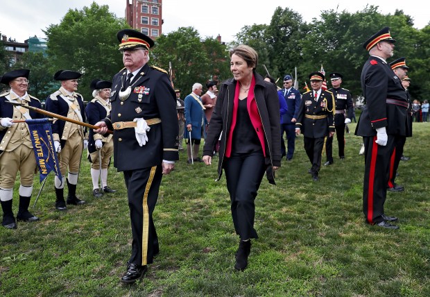 Gov. Maura Healey walks past the troops during the Ancient and Honorables 385th changing of the guard ceremony in Boston Staff Photo by Nancy Lane/Boston Herald (Monday,June 5, 2023). on the Boston Common on Monday, in Boston, MA. (Nancy Lane/Boston Herald) June 5, 2023