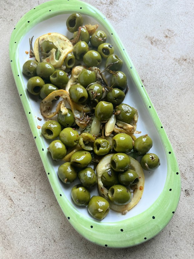 Herb-roasted olives are an easy nosh for a summer party. (Gretchen McKay/Pittsburgh Post-Gazette/TNS)
