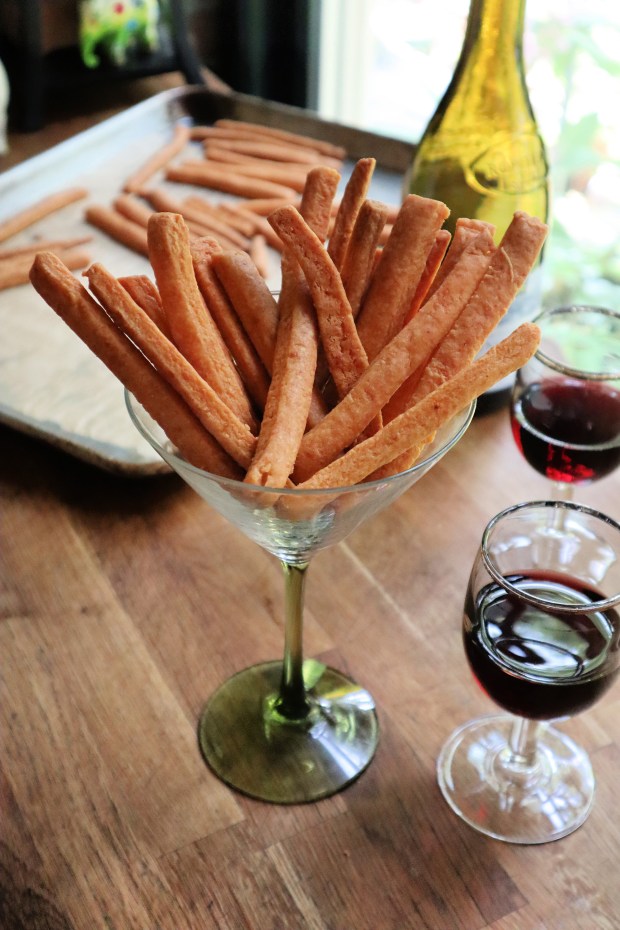 Rich and savory cheese straws pair perfectly with a glass of red or white wine. (Gretchen McKay/Pittsburgh Post-Gazette/TNS)