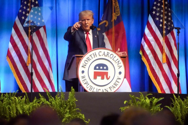 Former President Donald Trump points at the media during his remarks at the North Carolina Republican Party Convention on Saturday in Greensboro, N.C. (AP Photo/Meg Kinnard)