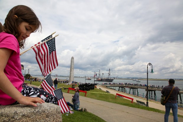 Boston MA - Crowds gather at Castle Island as the USS Constitution prepares to fire a 21 gun salute in honor of women veterans June 9, 2023 in Boston Massachusetts. (Photo by Reba Saldanha/Boston Herald)